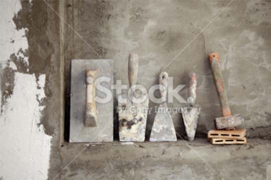 stock-photo-20303277-aged-construction-cement-mortar-used-tools